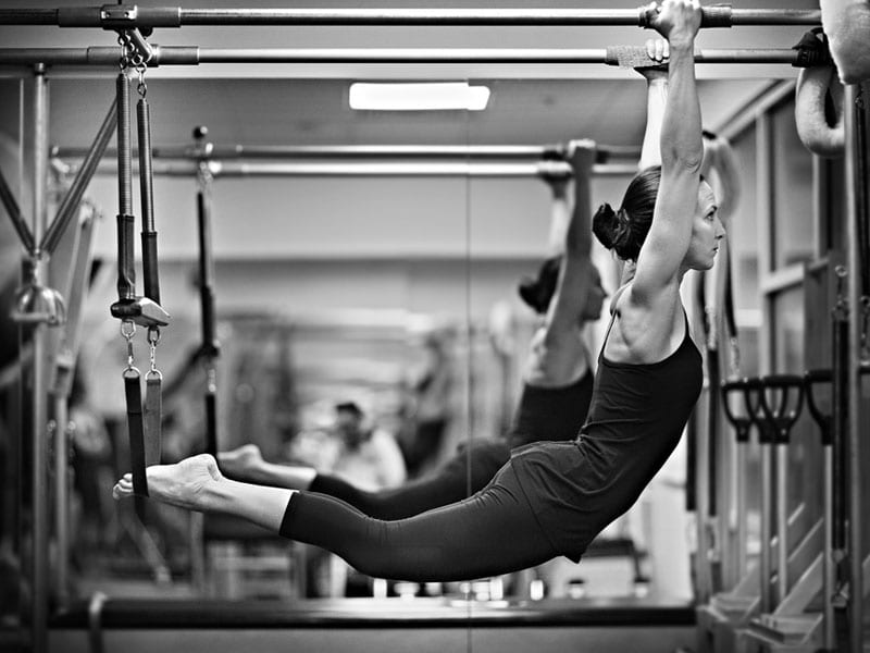 pilates stretch and hold on overhead rack